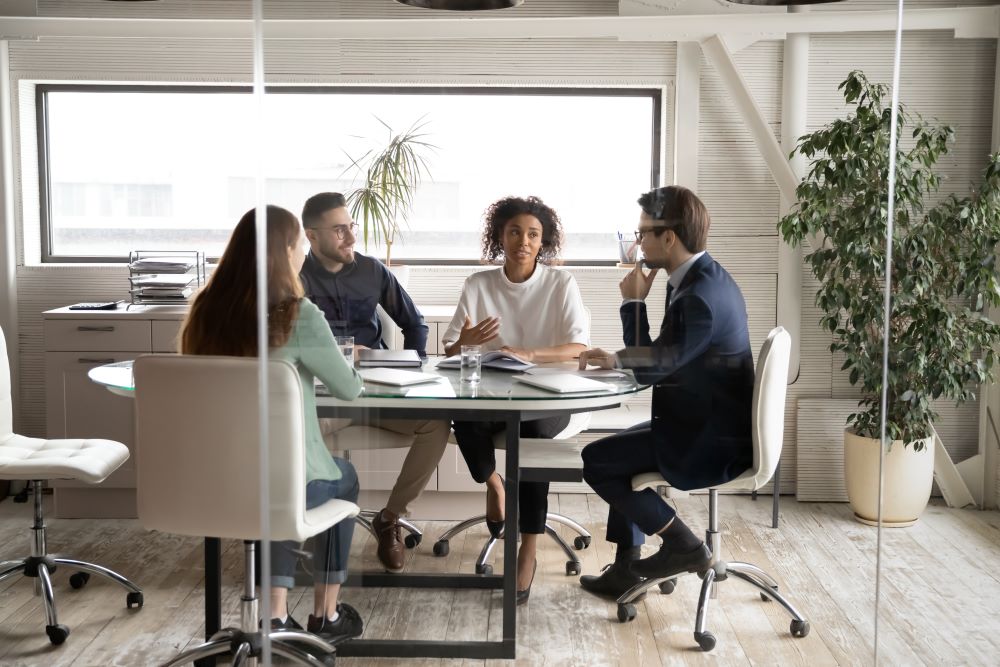 diverse group of employees in meeting room